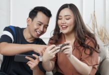 man and woman siting on sofa chair inside room