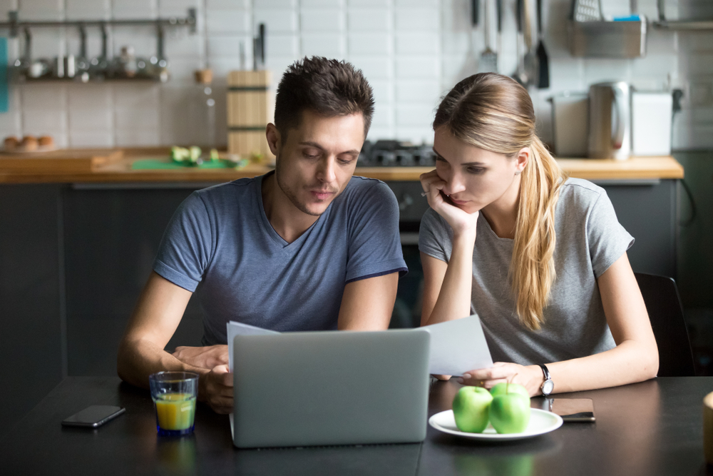 Shutterstock - Couple comparing Internet plans